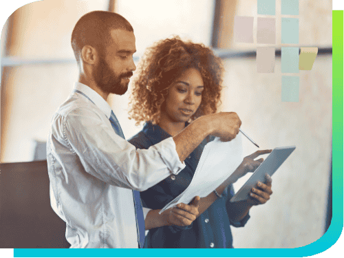 colleagues looking at report in office