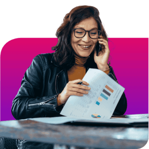 woman talking on phone holding a report